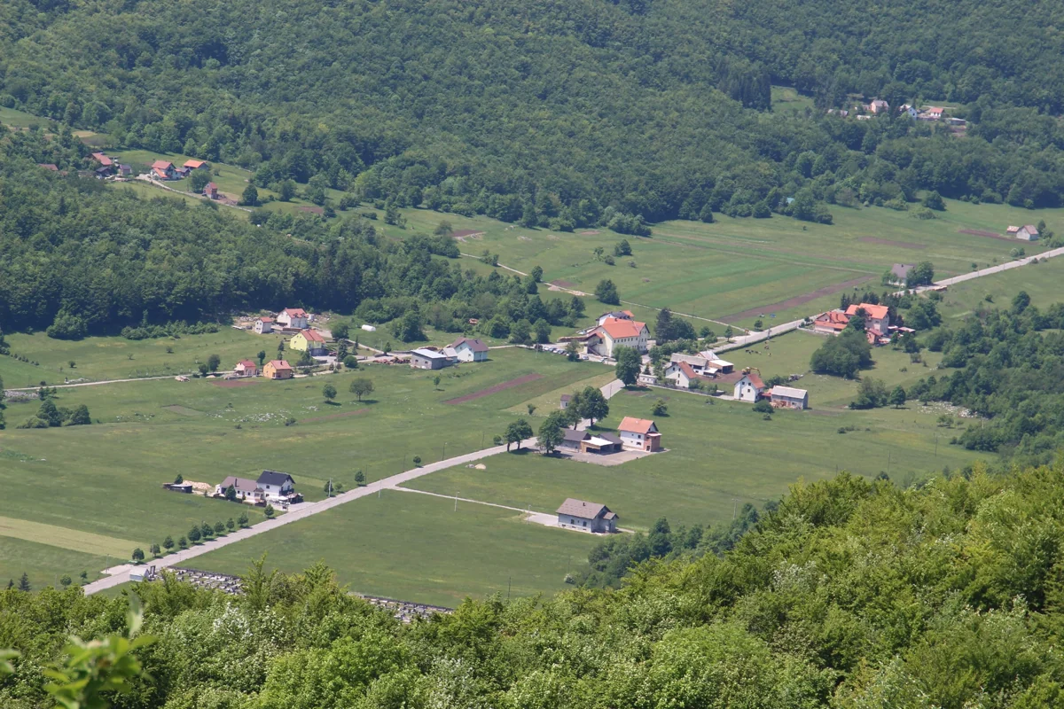 Krasno field and surrounding mountains, Croatia; 4 June 2021. Use as landscape around Velebit House, not a photo of the visitor-centre building.